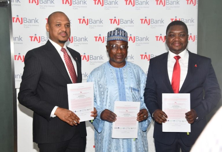 L-R: TAJBank Limited Managing Director/CEO, Mr. Hamid Joda; Board Chairman TAJBank Limited, Alhaji Tanko Gwamna, and the bank’s Co-Founder/Executive Director, Mr. Sherif Idi; displaying the TAJBank’s signed agreement for N20Bn Mudarabah Sukuk Bond Issuance at the bank’s headquarters in Abuja